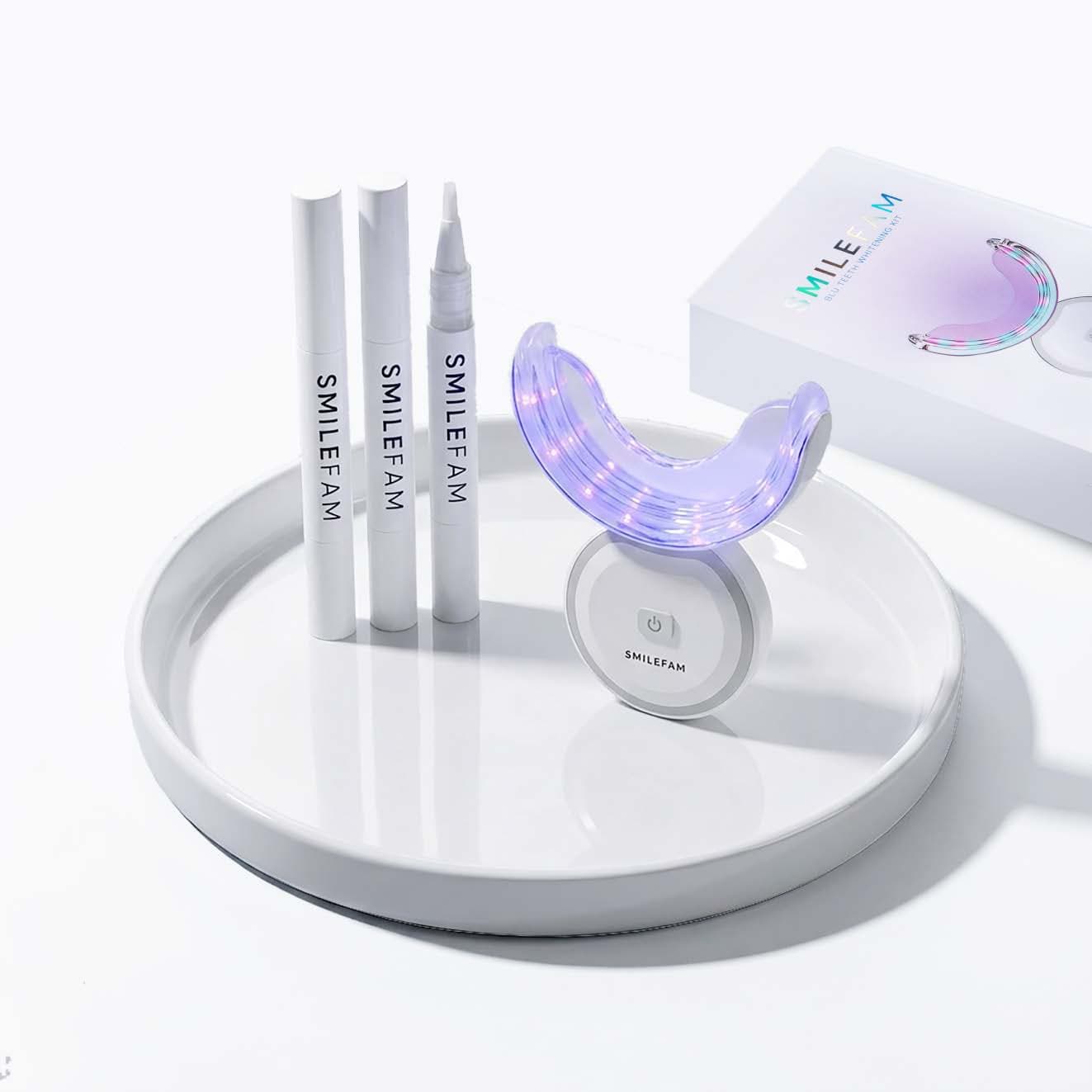 The SmileFam BLU whitening kit — LED device, whitening pens, and packaging